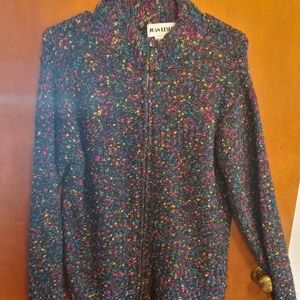 Sweater with colorful threads in.  Sweater zips up in front.